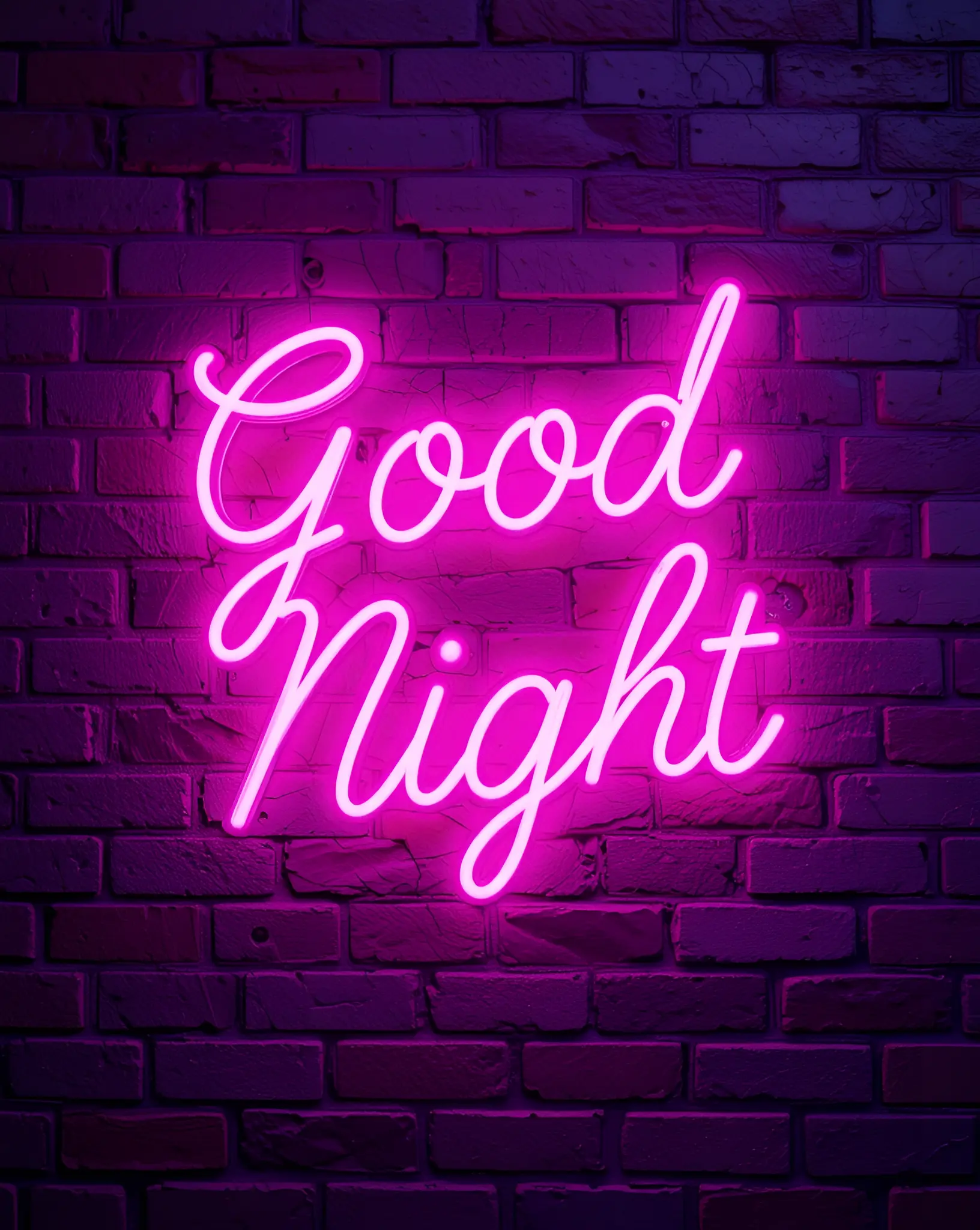 Neon Pink Good Night Sign Glowing Against Brick Wall Background at Night
