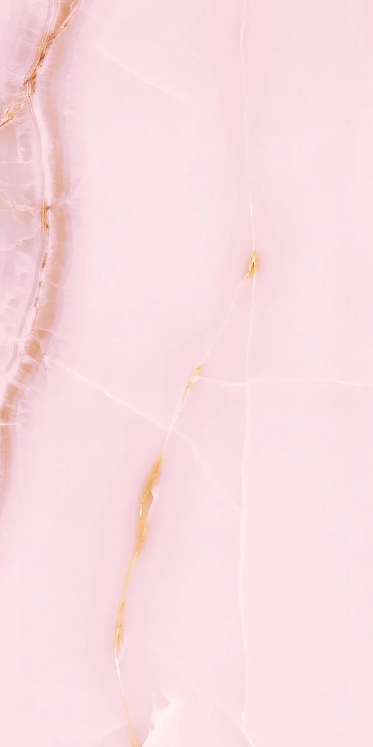 Elegant Pink Marble Surface with Golden Veins and Textured Details