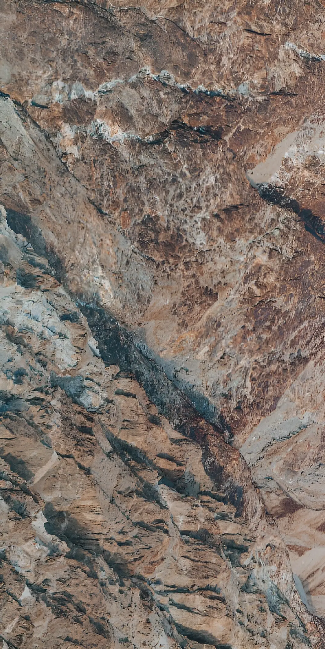 Natural Cliff Surface With Varied Textures and Earthy Colors