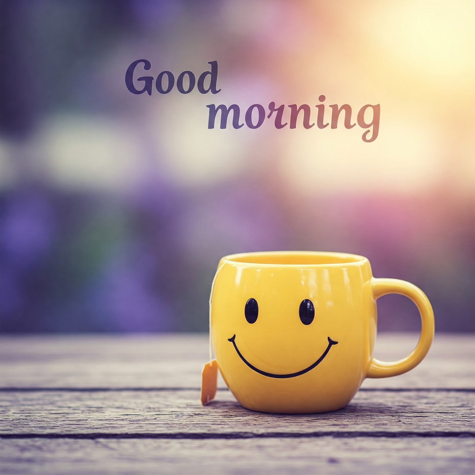 Yellow Smiley Mug on Wooden Table with Morning Sunshine